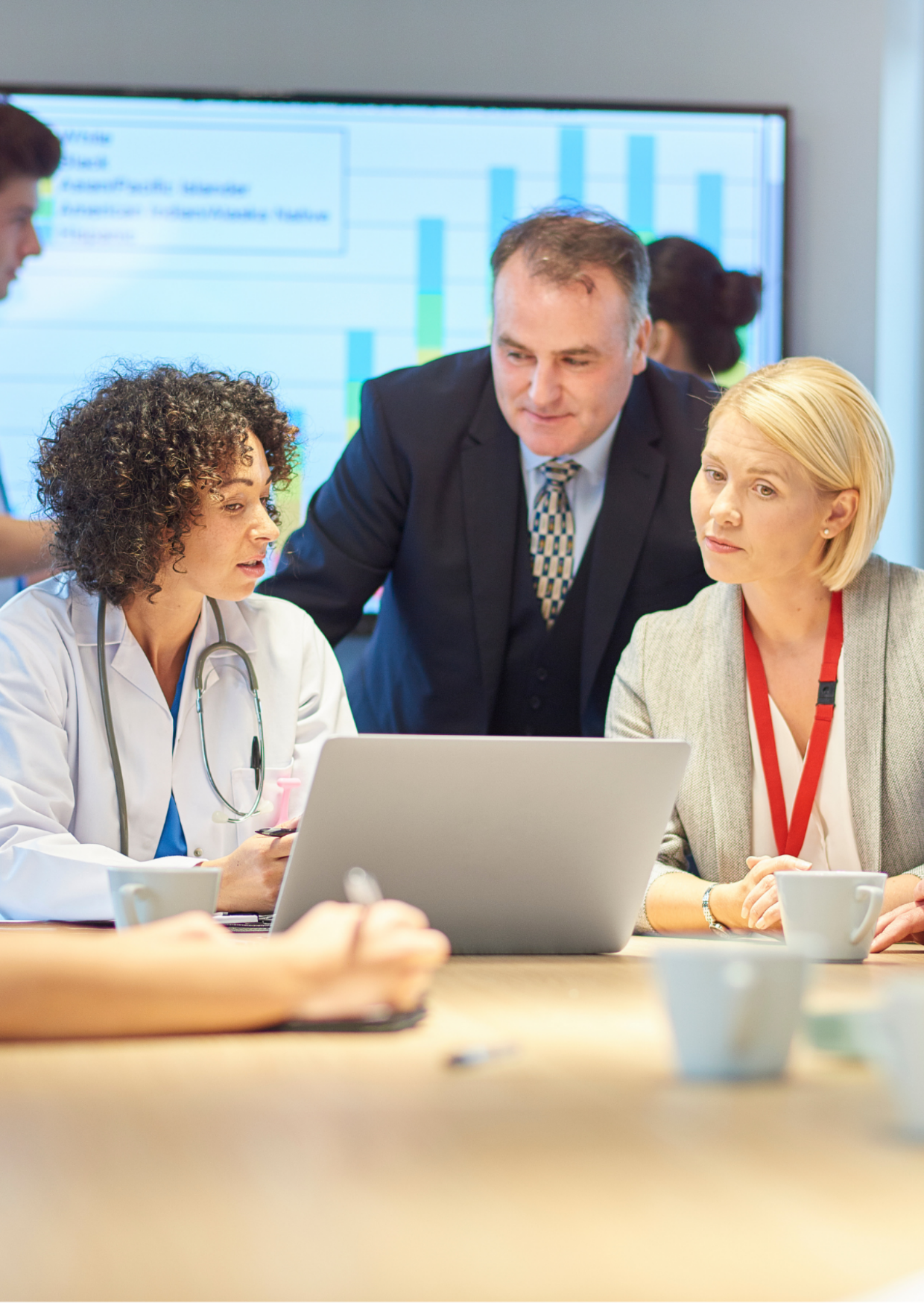 Clients 5 group of healthcare professionals and directors meeting around a conference table